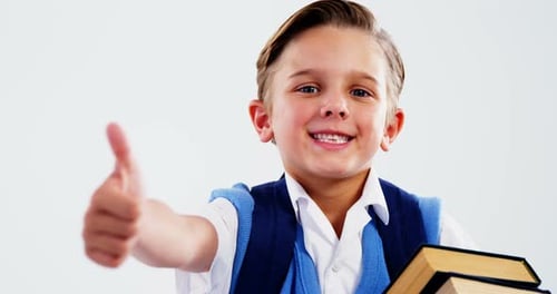 Enthusiastic Child Giving Thumbs Up with Books