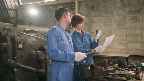 Professional workers teams work in the metalwork manufacturing factory.