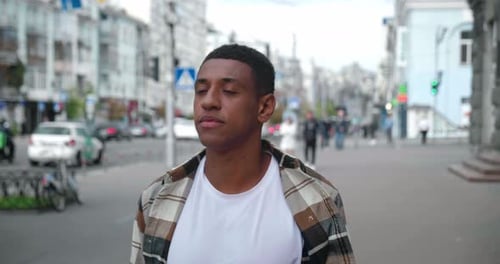 African American Man in Casual Cloth Walking on City Street