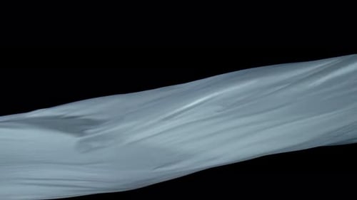 Silky Light Gray Sheet Flowing on Black