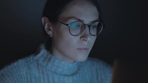 Attractive Female use smartphone at night. Close up. 4k.