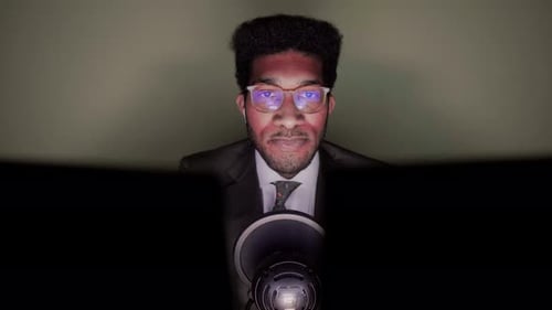 Businessman talking in video conference sitting in office