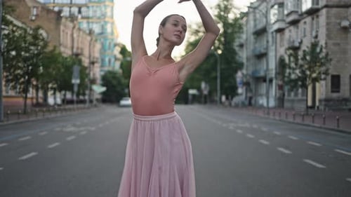 Graceful Woman Dances Ballet on Road with Rumble Strips