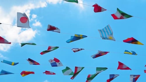 World Flags Fluttering Against a Blue Sky