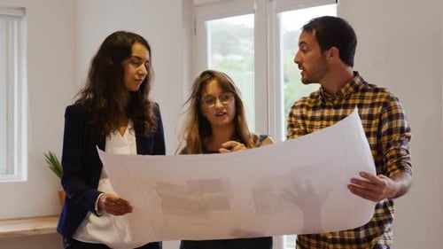 Millennial creative professionals working in a creative office