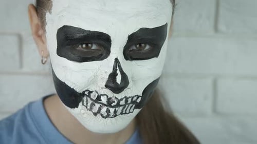Skull pattern on the face. Halloween.