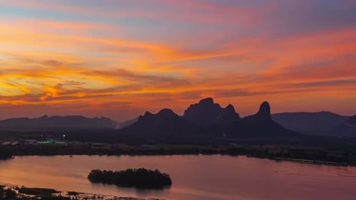 time lapse of beautiful sunset with Khao Jeen Lae mountain and river at Lopburi, Thailand