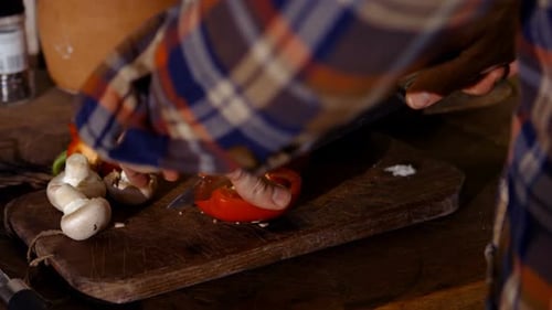 Slicing Bell Pepper with Mushrooms for Cooking