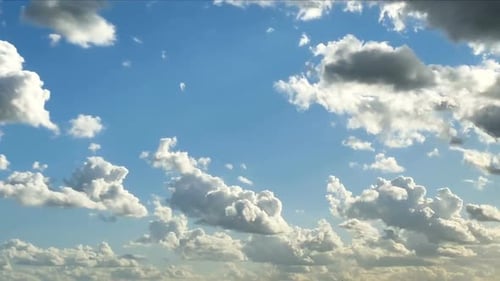 Clouds Moving Slowly Across a Blue Sky