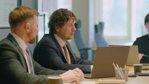 Business Team Meeting in Modern Office