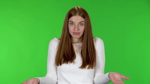Woman Shrugging on Green Screen Backdrop