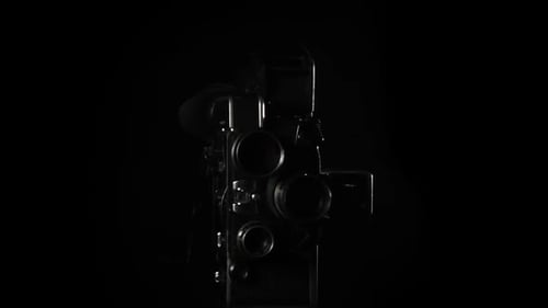 Rotating Vintage Film Camera in Dark Studio