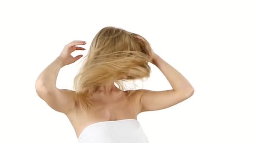 Smiling Woman With Blonde Hair and Towel Styling Hair