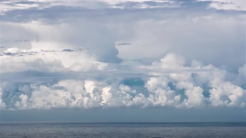 Heavy Stormy Clouds Forming over Blue Ocean