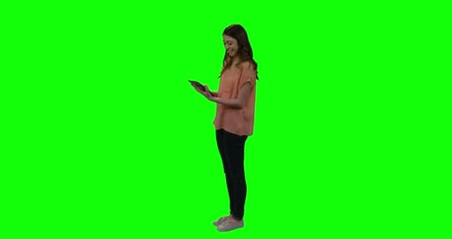 Woman Using Tablet on Green Screen Background