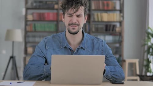 Man Expressing Frustration and Relief at Computer