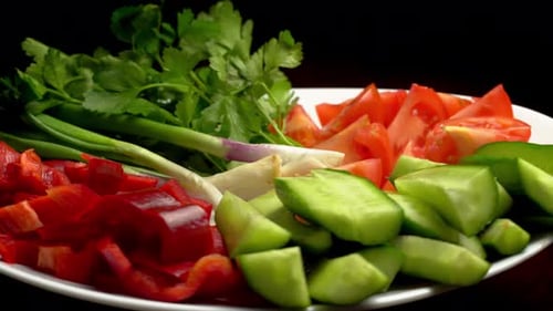 Assorted Sliced Vegetables on Rotating Plate
