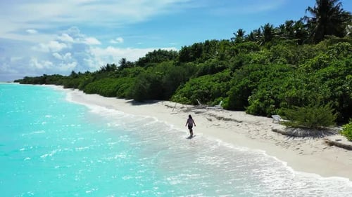 Single female tanning on beautiful sea view beach journey by transparent sea with white sandy backgr