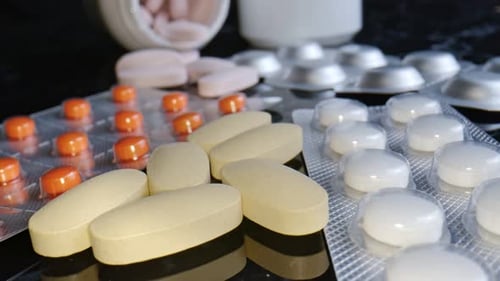 A Pile Of Medical Drugs And Capsules