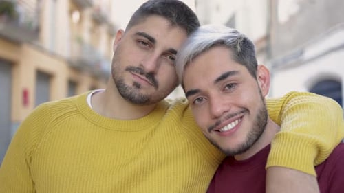 Loving Couple Embraces Affectionately on City Street