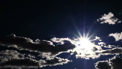 Sun Shines Through Clouds in Time-Lapse Video