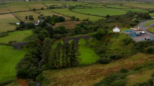Slide and Pan Aerial Shot of Historic Railway Bridge