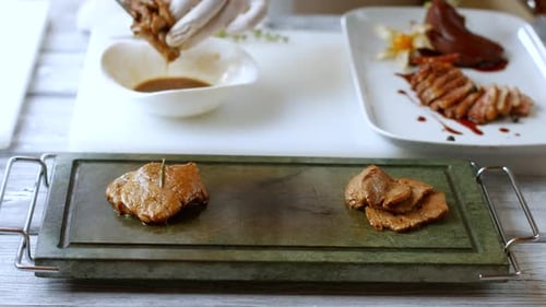 Chef Preparing Cooked Meat on Serving Dish