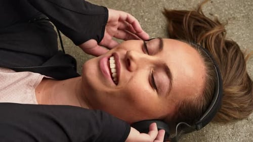 Woman Relaxing Listening to Music on Headphones