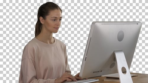 Young Adult Woman Typing at Computer on Chroma Key