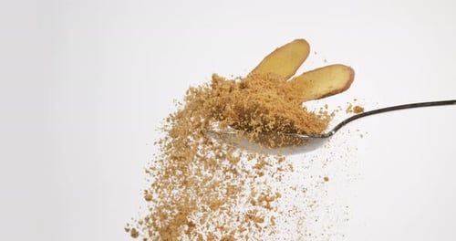 Ground Ginger and Root on Rotating Spoon