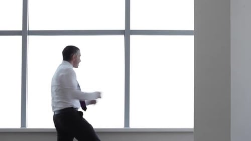 Happy Businessman Dances with Joy