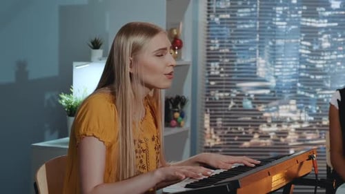 Woman Plays Piano and Sings in Apartment