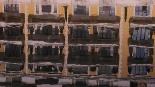 Reflection in the water of the hotel on a sunny day