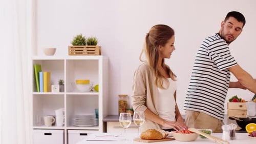Couple Cooking Together in Bright Kitchen