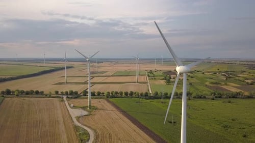 Aerial View of Wind Turbine Generators in Field Producing Clean Ecological Electricity