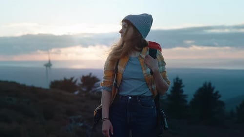 Woman Hiker on Adventure Trip in Mountain Sunset
