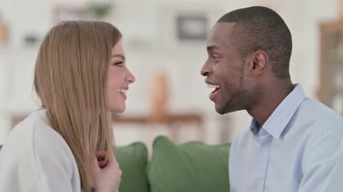 Smiling Man and Woman Enjoying a Conversation