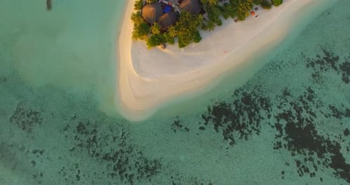 Aerial drone view of a scenic tropical island in the Maldives.