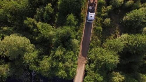 Forestry and logging operations taking place in the highlands of Scotland using large industrial mac