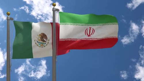 Waving Flags of Mexico and Iran on Blue Sky