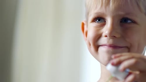 Cute Boy Playing with Bubble Blower