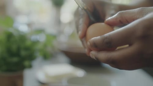 Cracking Egg into Bowl