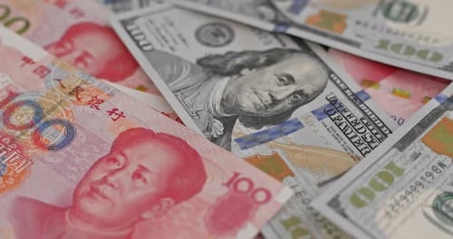 US Dollars and Chinese Yuan Close Up