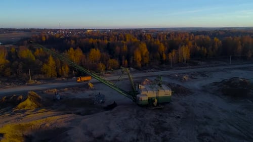Aerial View of Excavation Site with Large Crane