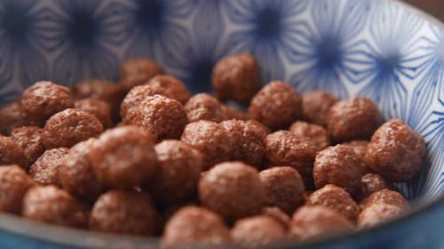 Close Up of Chocolate Corn Flakes in a Bowl on Table