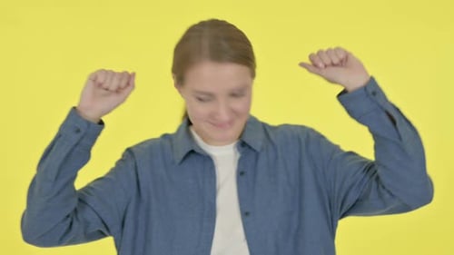 Woman Dancing Against Yellow Background