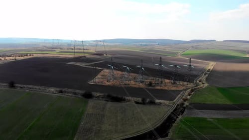 Aerial View of Power Lines Over Rural Landscape