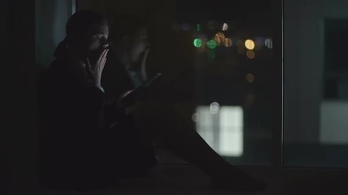 Tired Businesswoman Using Tablet in Night Office