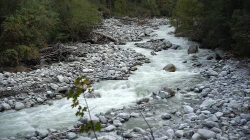 View of a Fast Flowing Mountain River. The Camera Monitors the Movement of Water.