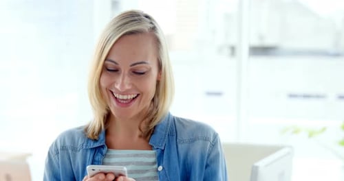Happy Woman with Phone in Bright Office